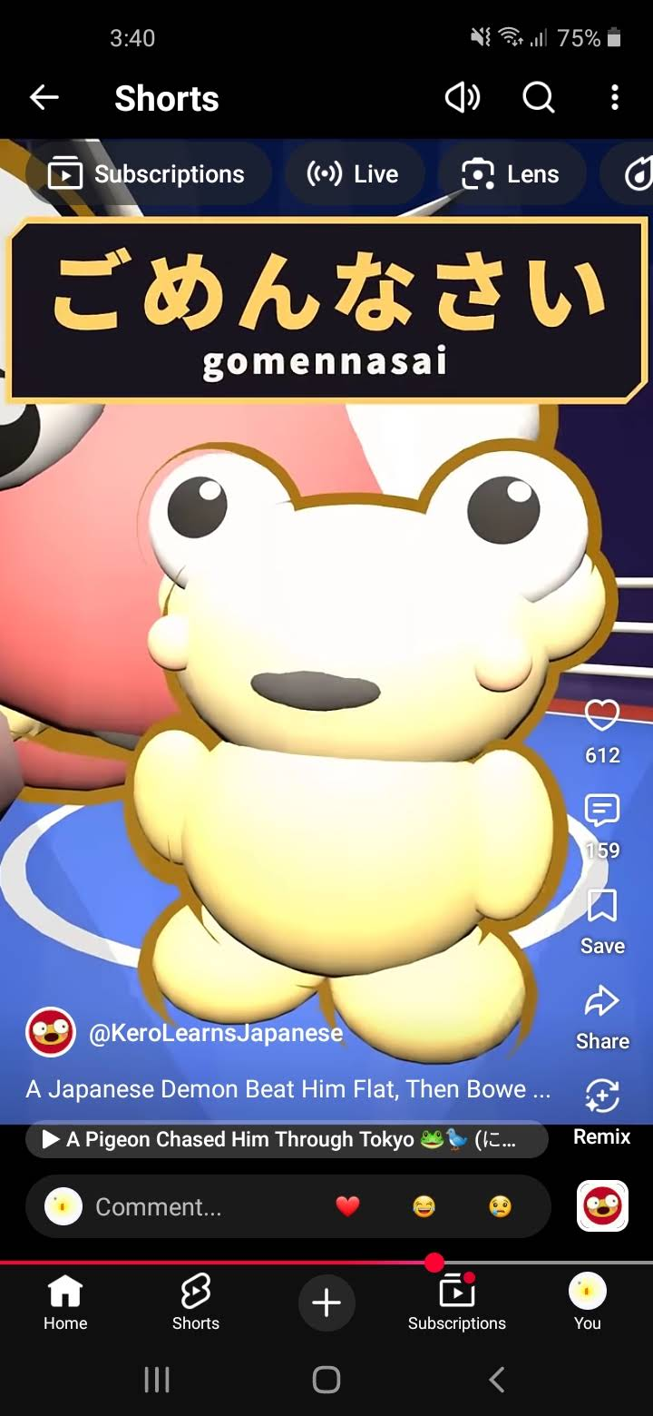 A phone screenshot from a Kero short, showing a wide-eyed golden Kero in front of a much larger pink character beneath the Japanese word gomennasai. The original phone and video controls remain visible.