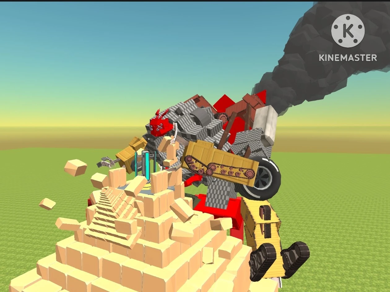 A screenshot from a blocky 3D game under a blue and yellow sky over green grass. A robot built from construction machine parts, with a red head with little round eyes, grey checked blocks, a yellow crawler track, a big black wheel, a claw and red and yellow legs on black tracked feet, smashes through a pyramid of sand coloured blocks, sending blocks flying, while black smoke pours up behind it. A KINEMASTER watermark sits in the top right corner.