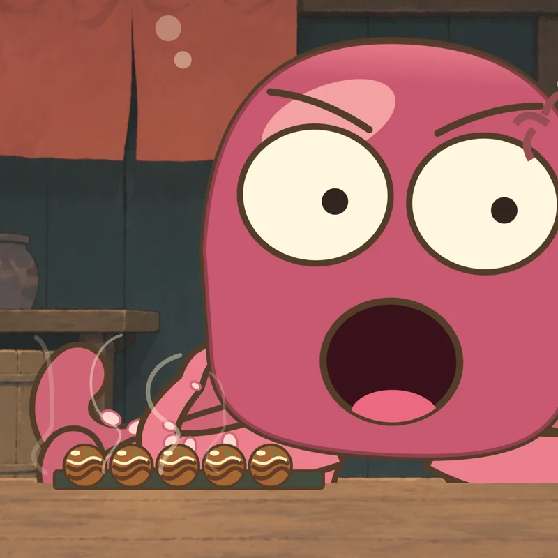 The chef shouts over his tray of takoyaki.