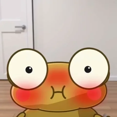 Golden Kero with huge eyes blushes bright red with puffed out cheeks, in front of a white door and a wooden floor.
