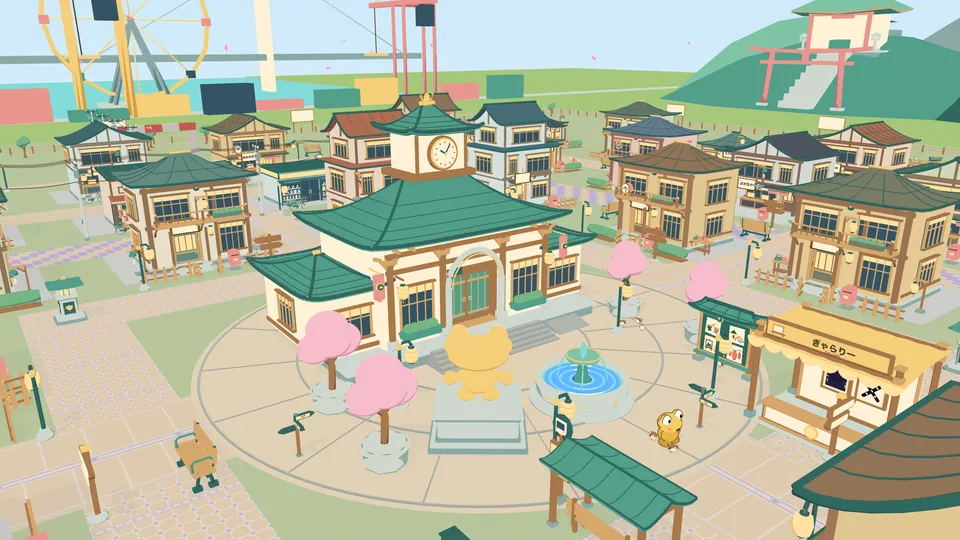 Kerotown from above. A town hall with a clock tower stands behind a fountain and a gold frog statue, with shops, cherry trees and a big wheel all around.